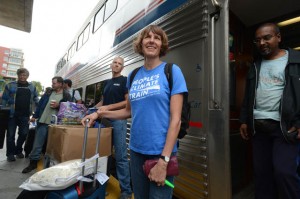 Wearing a shirt of her own design, Linda Currie prepares to board the Climate Train in Emeryville.  Photo:  Kristopher Skinner/Bay Area News Group